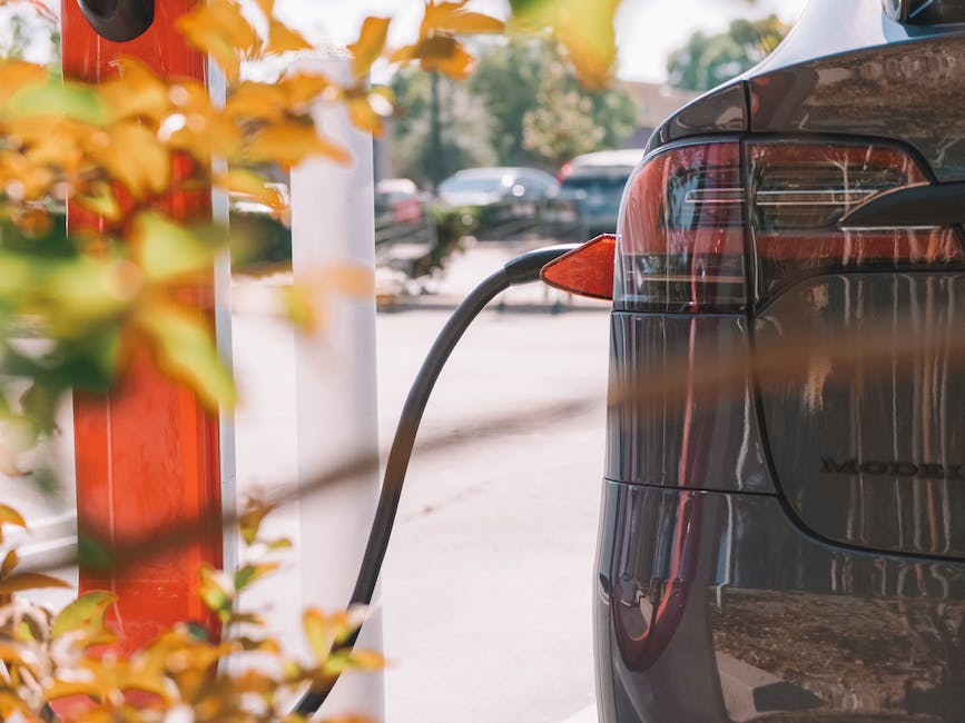 Illustration of a Tesla car connected to a charging station