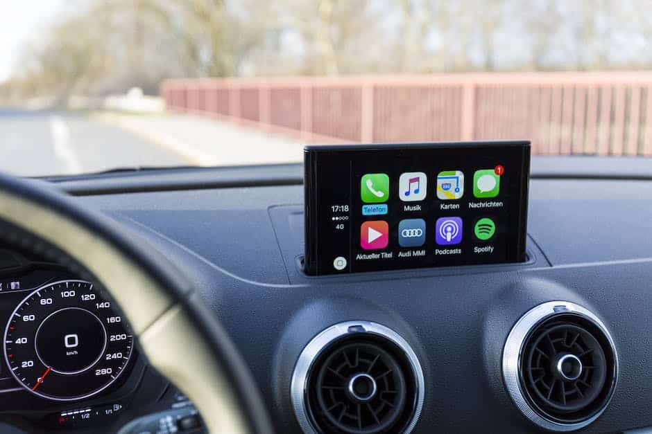 A simplified black and white image of the Tesla Navigation System, showing a touchscreen with a map displayed on it.