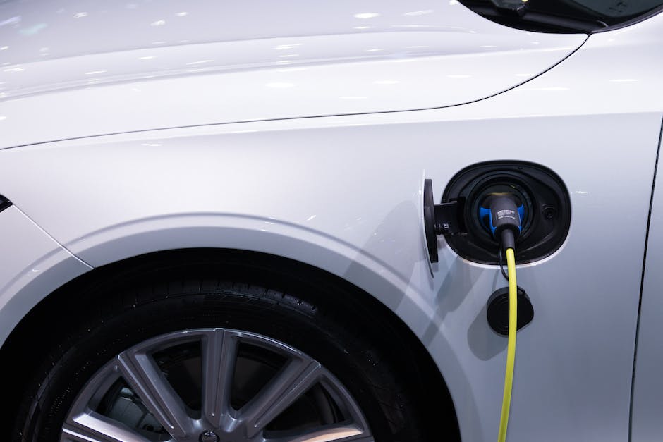 Image showing a Tesla car being charged, representing the range and charging system of Tesla cars