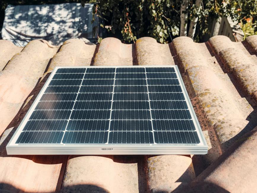 Illustration of a Tesla Solar Roof installation, showing sleek solar tiles integrated with the existing roof.